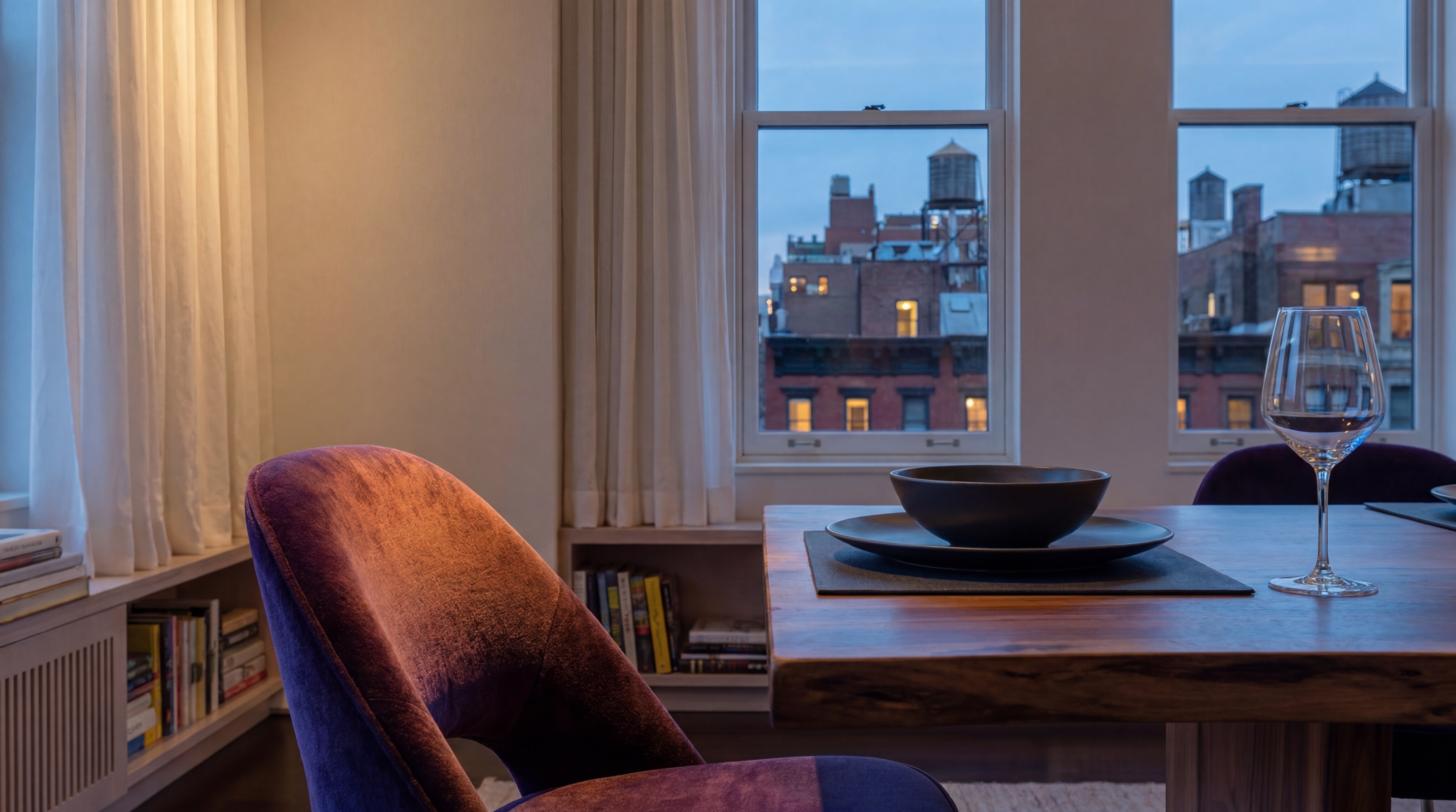 Dining table set for dusk above the Greenwich Village rooftops