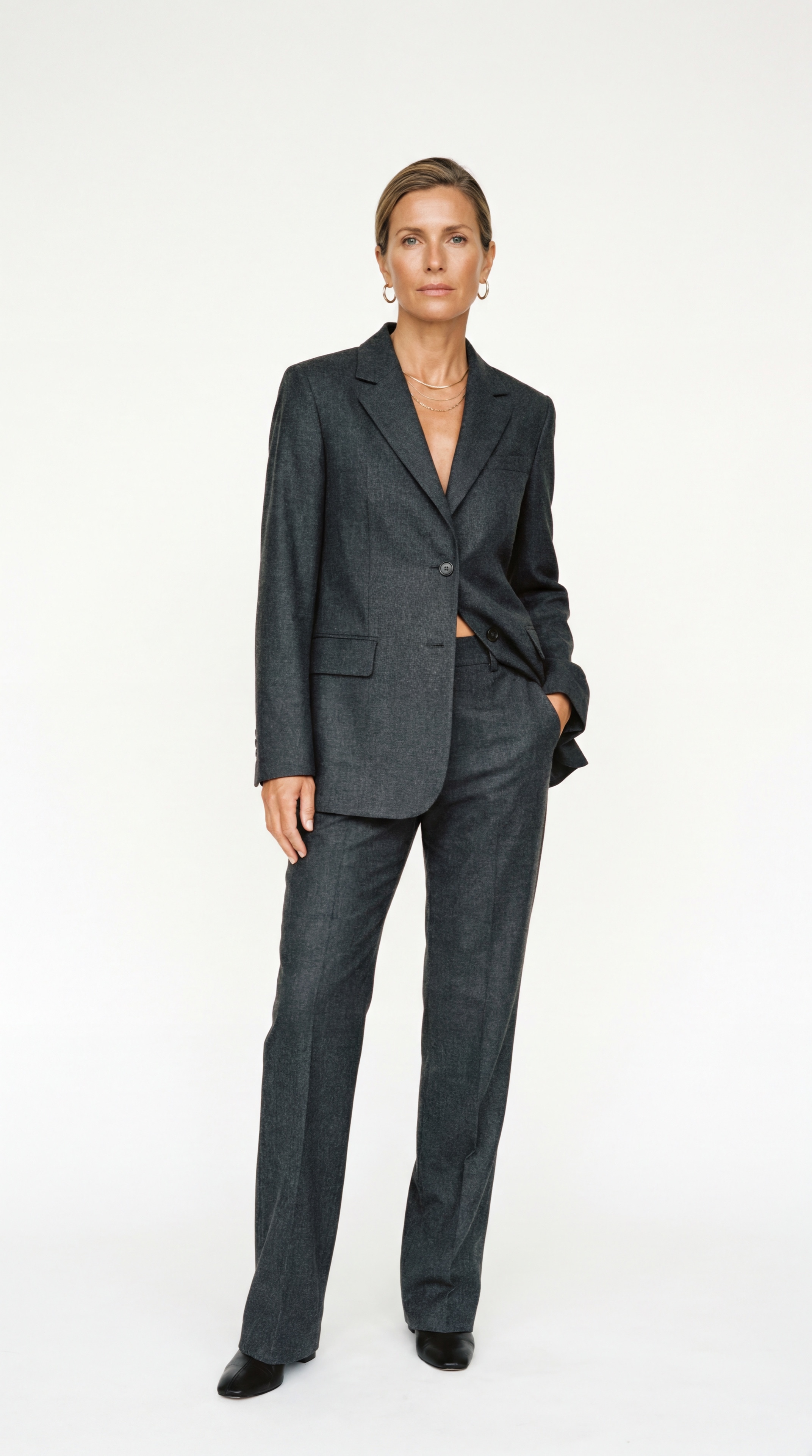 Resident in a charcoal tailored suit, front